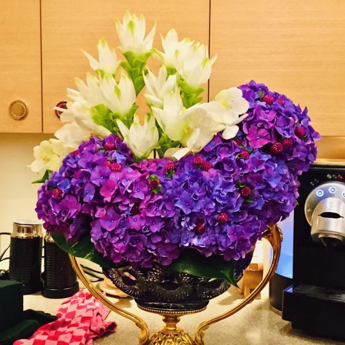 Hydrangea and vanda in a gilt urn